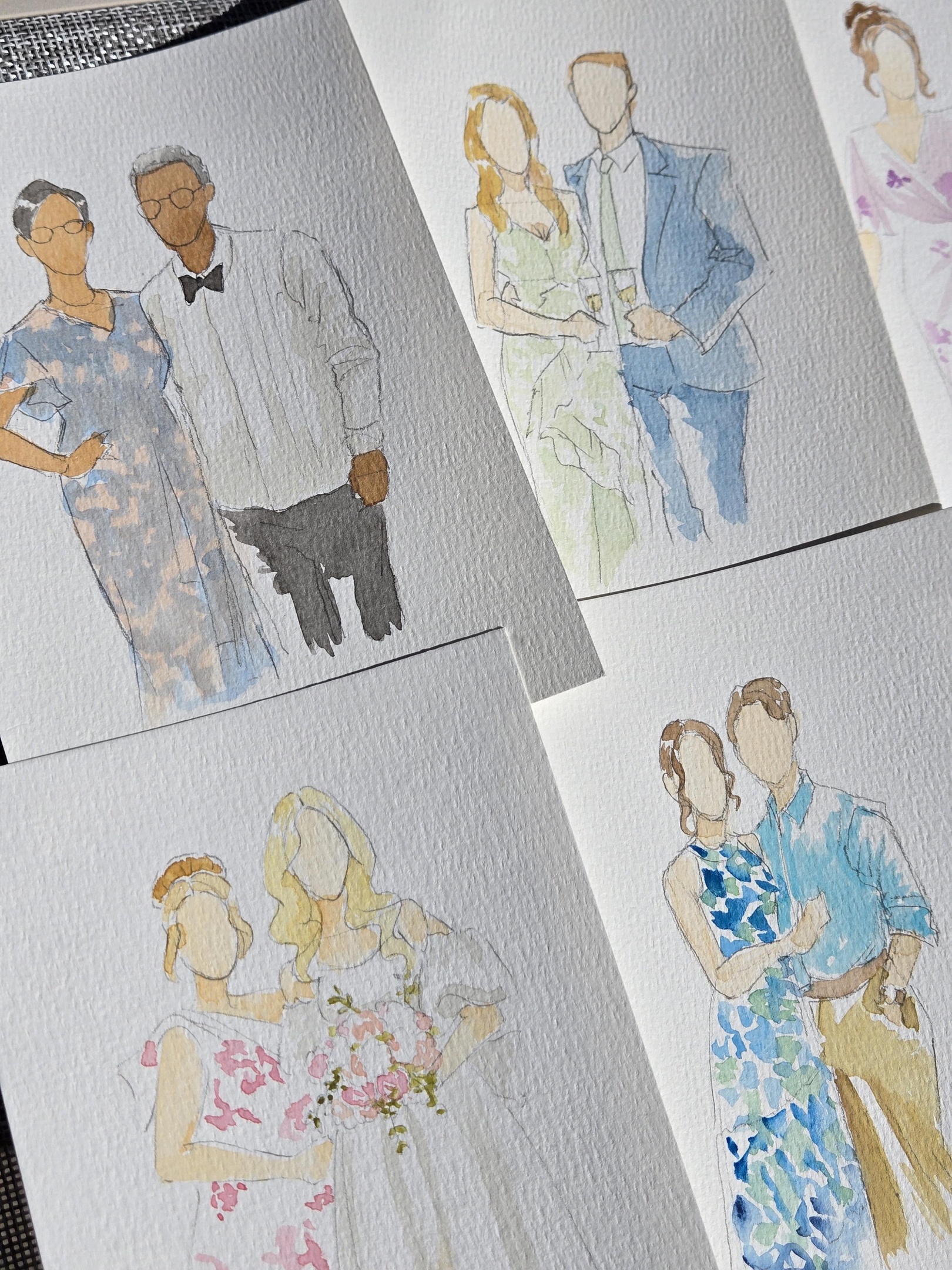 Two bridal shower guests smiling and holding their finished custom watercolour portrait